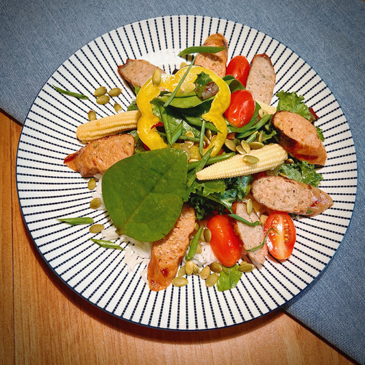 Saucisses Grillées avec Sauté de Tomates Séchées et Kale servi avec Couscous